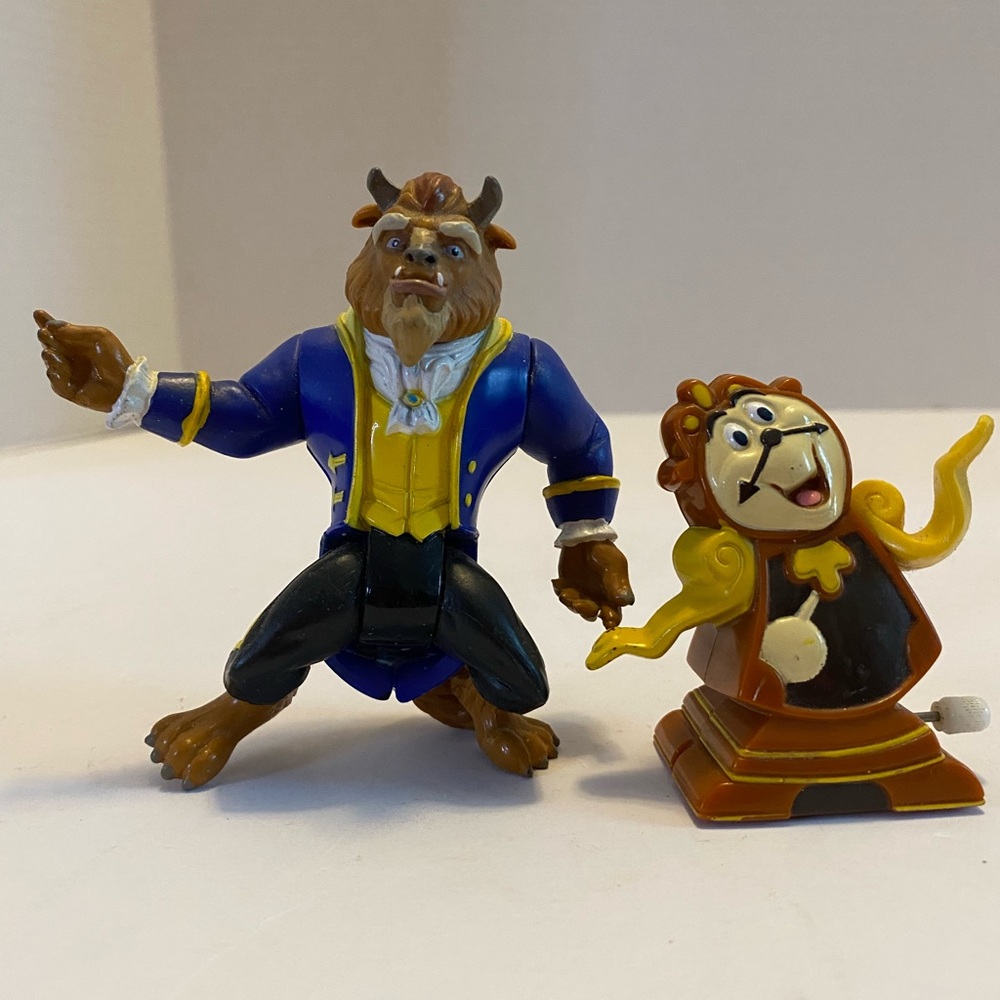 Disney Beast and  Moving Cogsworth Figurines in Blue and Yellow Vintage Toys